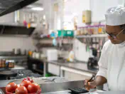 A chef works in a kitchen