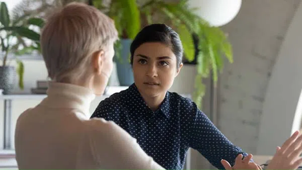 Women having conversation.