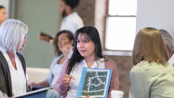 Woman displays map of HOA